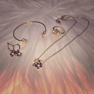 Coach flower/pearl set.